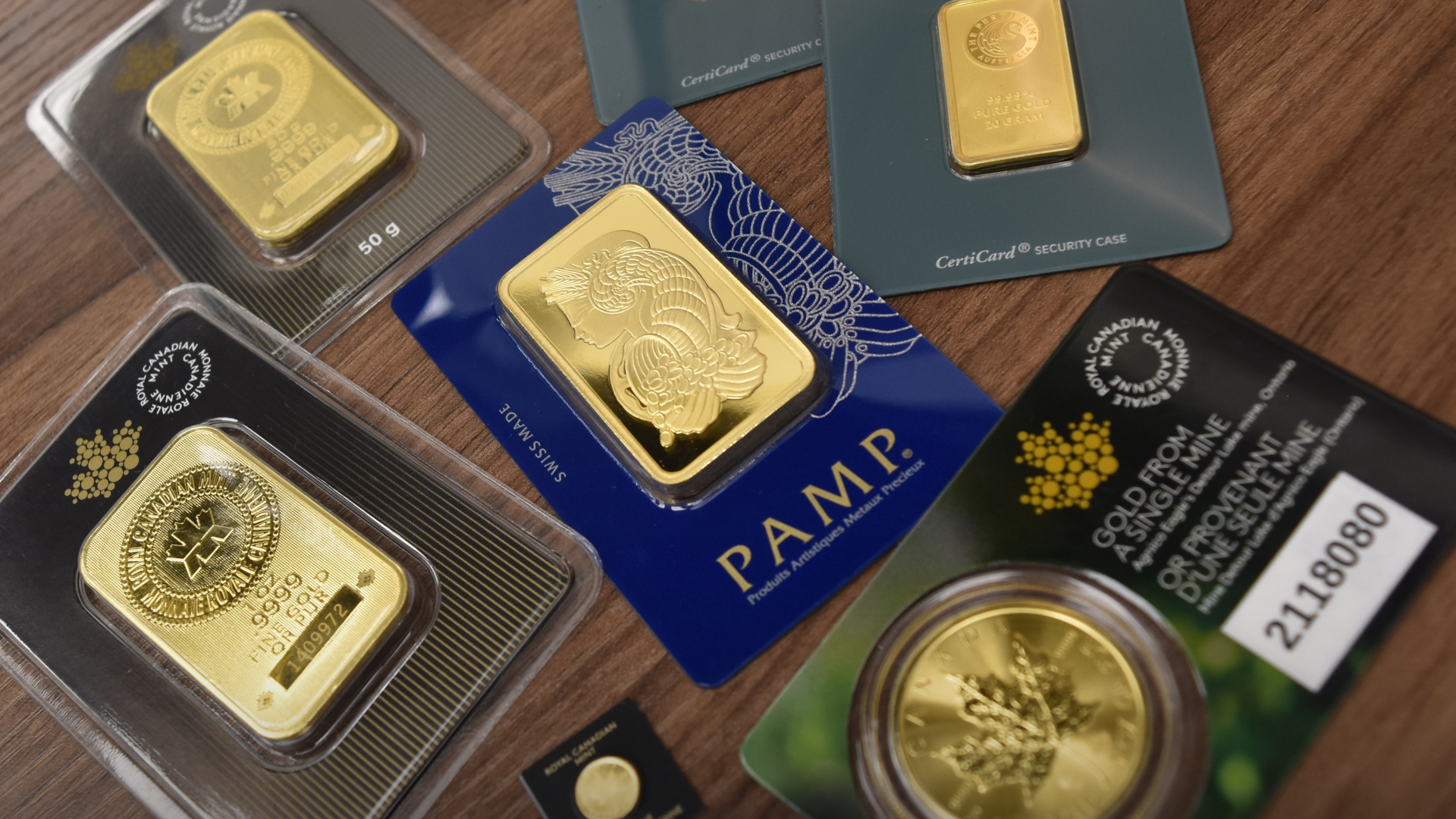 Variety of 1 ounce gold bars and coins