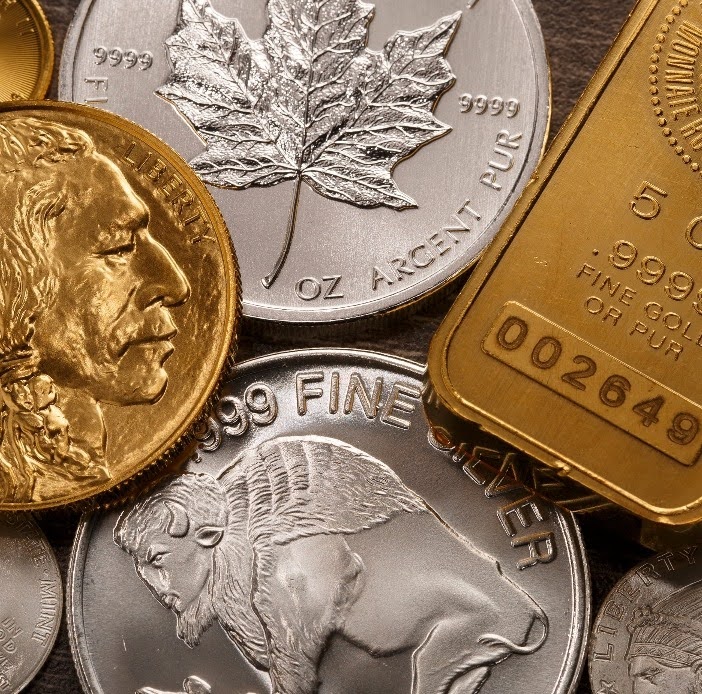 Variety of gold and silver coins and bars